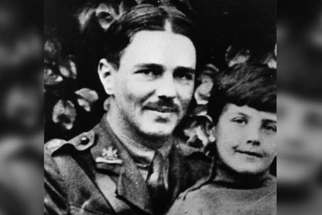 British soldier and war poet Wilfred Owen (1893 - 1918) in uniform with a young boy, circa 1917. (Photo by Evening Standard/Getty Images)