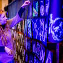 Liberty Ingham, the daughter of the artist in residence at St Mary’s Church, Petra Ingham, looks at some of the artwork that was produced during a community workshop centred on the installation by international artist Peter Snijder.