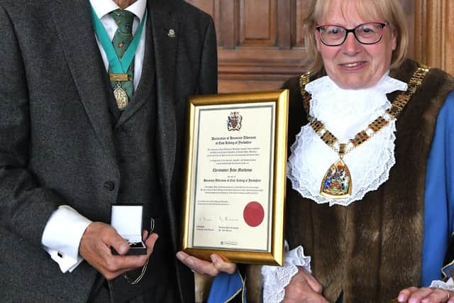 Honorary Alderman Chris Matthews, left, with chairman Councillor Linda Bayram