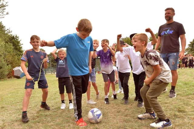 Gallows Close Hawaiian fun day - taking on the football challenge.
223191c