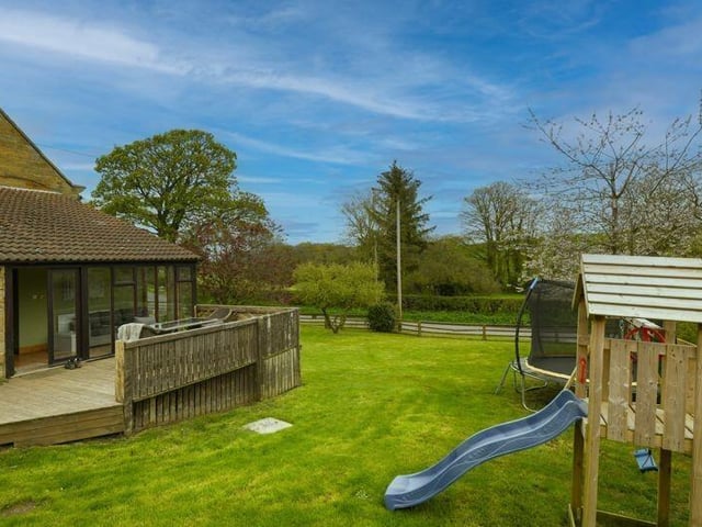 The garden has plenty of space for children's play equipment.