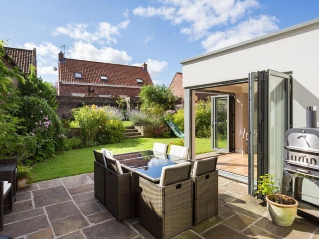 Patio seating and the south facing lawned garden.