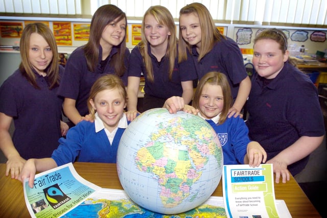 Pupils from George Pindar Community Sports College visit Seamer and Irton School to promote Fairtrade. Front (from left) Seamer pupils Amelia Carver and Mollie Bird with Pindar students (back from left) Mollie Holder, Jade Hutchinson, Emma Cairney, Zoe Atkinson and Rachel Harker. 081032