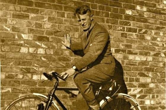 Aircraftsman Shaw (TE Lawrence) in front of the red-brick wall at Bridlington harbour.