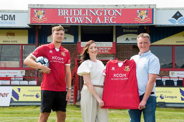 Celebrating KCOM being announced as the new Community Partner and shirt sponsor for Bridlington Town AFC, are, from left, Town striker Toby Marriott, Suzanne Harvey, Head of Marketing, KCOM and Daniel Rogers, HDM Energies CEO and Club Chairman. Picture: Sean Spencer
