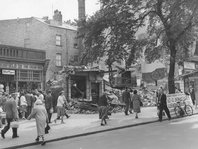 Demolition of the Londesborough cinema in 1960. In the photo, a crowd of people have found something of interest in the window of Sinfield confectioners and tobacconist.