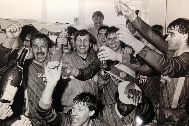 Neil Warnock and his Scarborough FC players celebrate promotion to the Football League