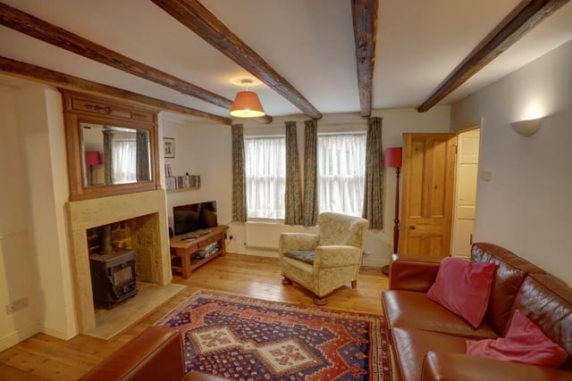 An alternative view of the lounge, showing its sash windows that allow natural light to pour in.