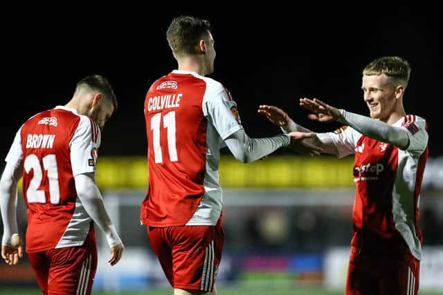Jack Waldron congratulates Luca Colville on his assist for Dom Tear's opener as Scarborough Athletic won 2-0 at home to Radcliffe. Photo by Zach Forster