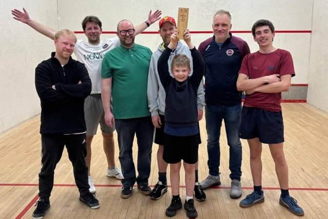 Scarborough Squash Academy 3rds hold aloft the Eddie Fisher Trophy after winning the York Squash League third division title in their debut season.
