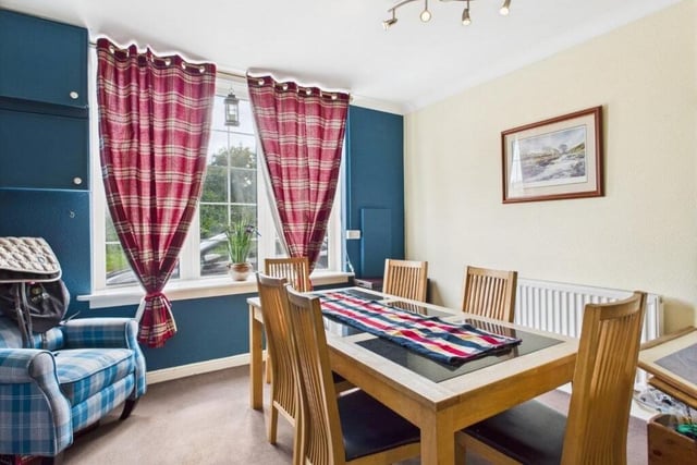 The dining room links to a snug area.