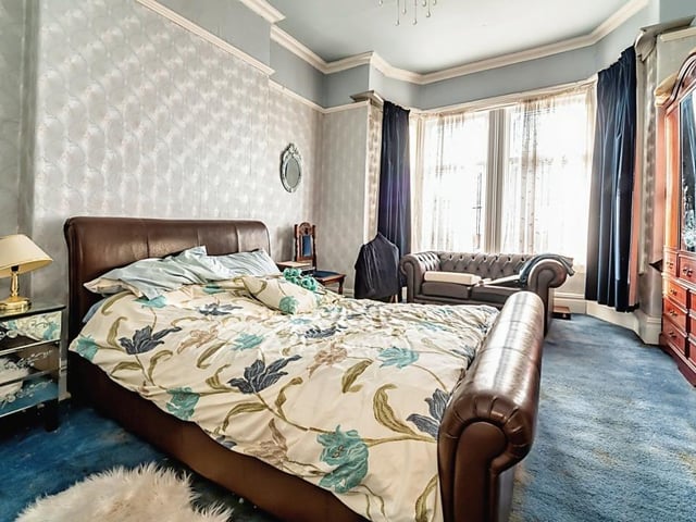 Large and light bedrooms include this one with a bay window.
