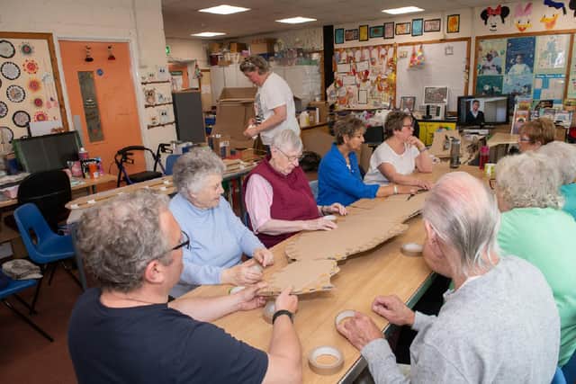 A community group at Falsgrave Community Centre building cardboard soldiers for the sculpture, led by Lee Threadgold from the Animated Objects Theatre Company