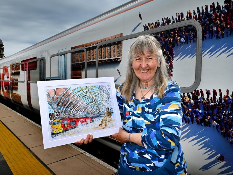 Artist Glynis Dray showing off her work.