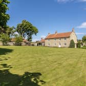 Looking across its garden and grounds to Rosary House.