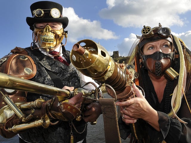 Take aim - time travellers John and Karen Ward. 144430q