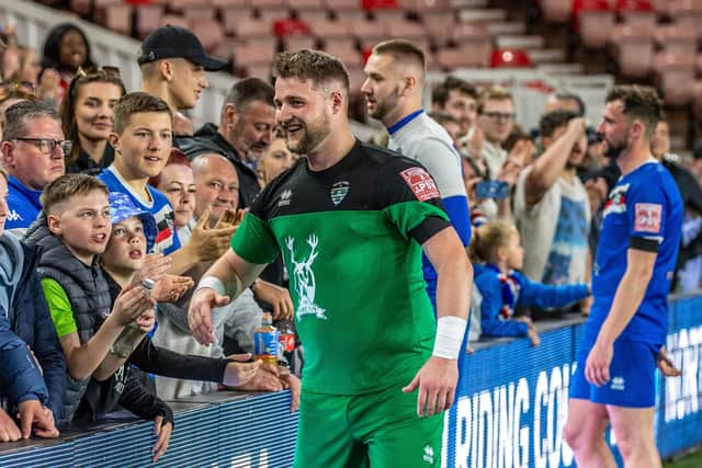Blues keeper Shane Bland thanks the fans after their cup final win.