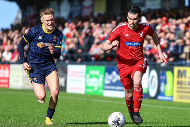 Boro man of the match Alex Purver races clear of Danny Greenfield.