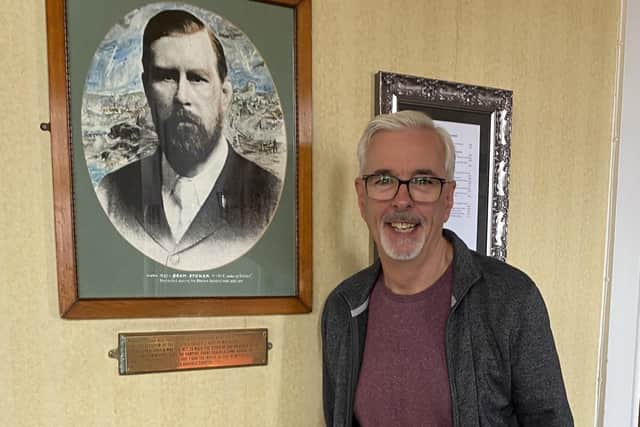Author TG Trouper, pictured next to a photograph of Bram Stoker at the Royal Hotel in Whitby.