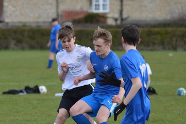 Battling for possession in the League Cup encounter.