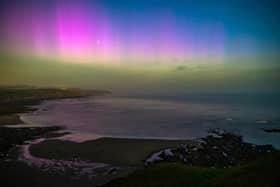 Spectacular pinks and purples light up the sky as the Aurora Borealis shines over Scarborough's Jackson Bay.