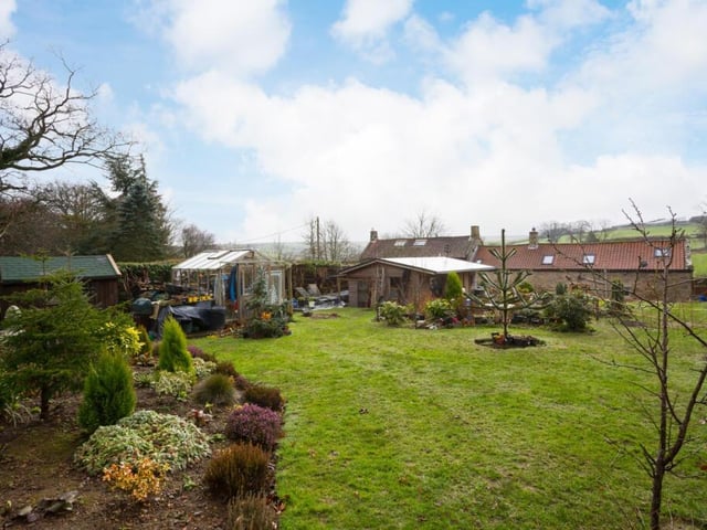 Looking back towards the cottage from its extensive lawned garden.