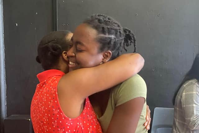 Shalom hugs her mother after receiving her results