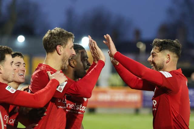 Richie Bennett celebrates his leveller with his Boro team-mates at Southport. Photo by Disport Photography