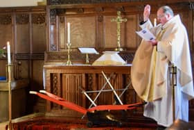 The Rev Michael Gobbett performs the traditional Blessing of the Plough at Goathland Church.
Picture by Michael Trimble.