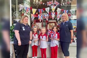 Guider Charlotte, Ava, five 5 ,  Ella, five , Isla, five and Guider Sue outside Lilly's Treasures in St Nicholas Street, Scarborough