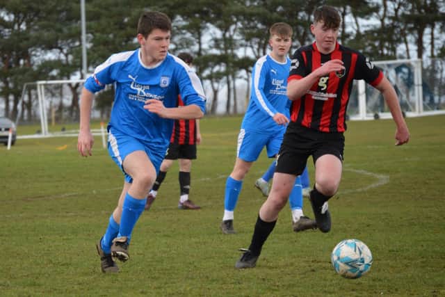 Heslerton Under-16s (blue) v Huntington. Photo by Cherie Allardice