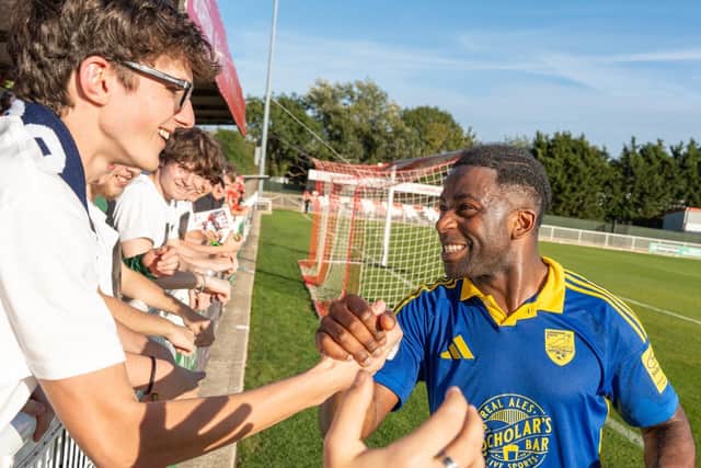 Goalscorer Kieran Weledji celebrates his leveller at Brackley with the travelling Seadogs fans. Photo by Wilkins Photography