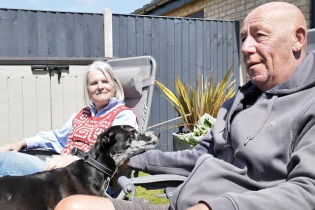 Jeanette and Martin Hodgson with their eight-year-old Lurcher Stan.