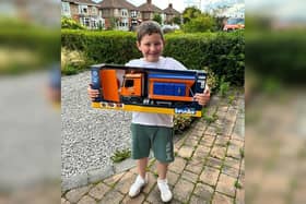 Nine-year-old Cory Small won the name-the-gritter competition with the name 'Snowy Tribbiani', and has been presented with is prize.