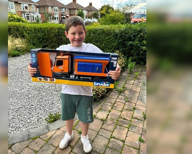 Nine-year-old Cory Small won the name-the-gritter competition with the name 'Snowy Tribbiani', and has been presented with is prize.