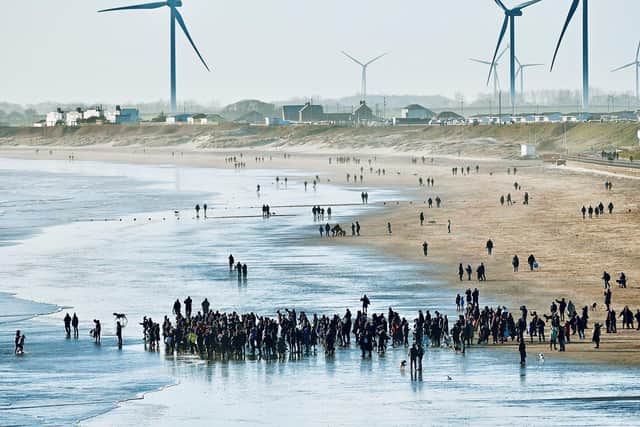 Aled Jones frames people at the Boxing Day Dip.