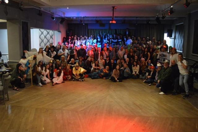 Group photo of most of the Whitby pub crawlers at The Royal Hotel ballroom.