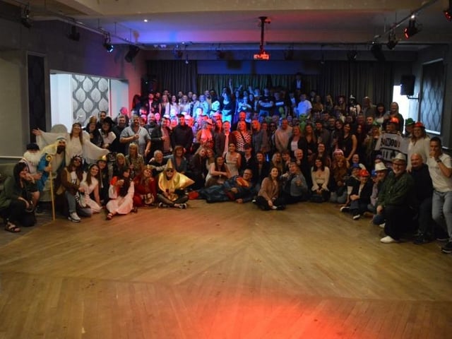 Group photo of most of the Whitby pub crawlers at The Royal Hotel ballroom.