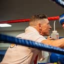 Westway Boxing Club coach George Rhodes Snr gives Archie Ashworth advice.