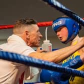 Westway Boxing Club coach George Rhodes Snr gives Archie Ashworth advice.