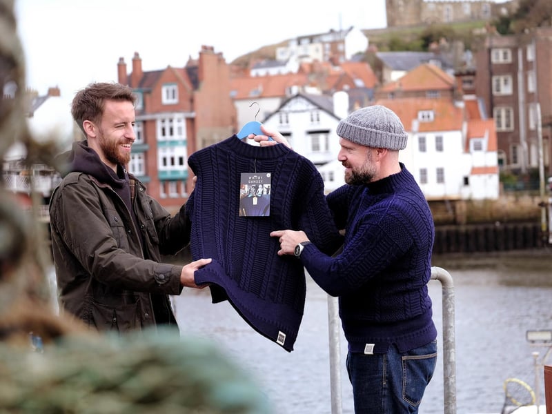 Callum Siclair checks out a Whitby Gansey with Mathew on the quayside.
picture: Richard Ponter, 224744l