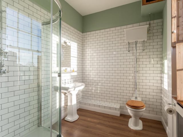 A walk-in shower is a feature of this modern house bathroom.