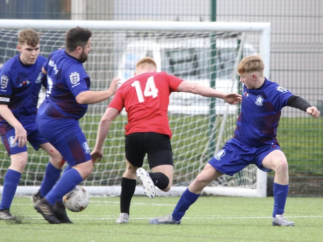 A Club Atletico de Bransholme player tries to break through against Brid Rovers Pandas