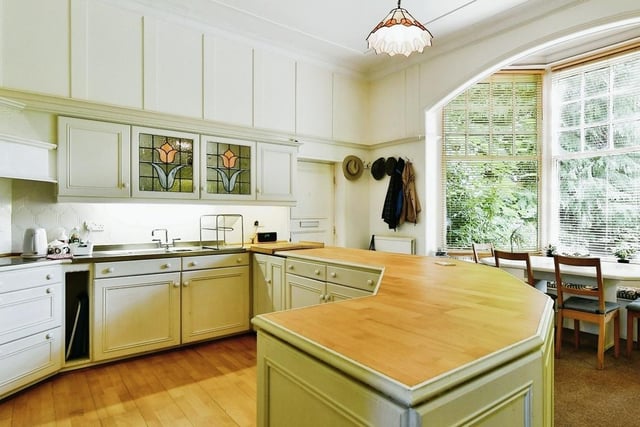 The kitchen has a large bay window with inbuilt seat.