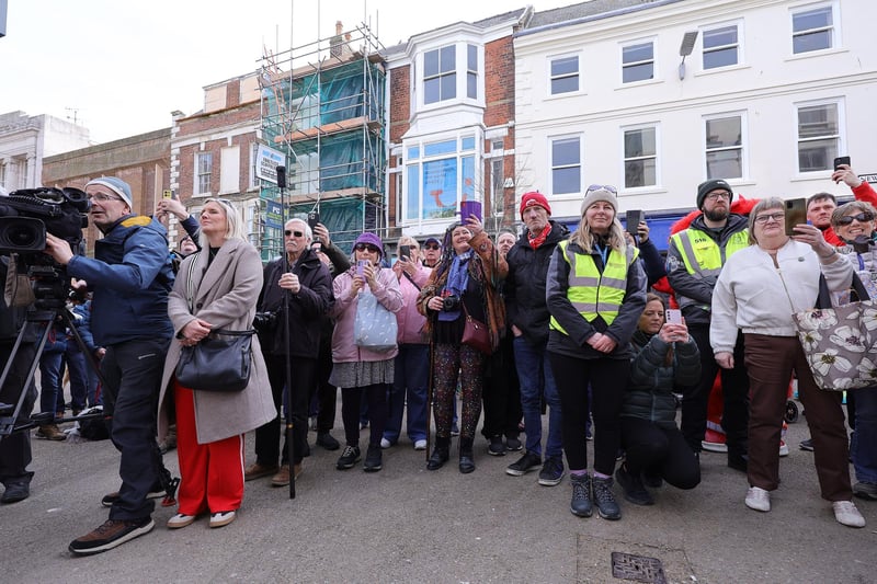 The crowd gather at the Pancake Bell