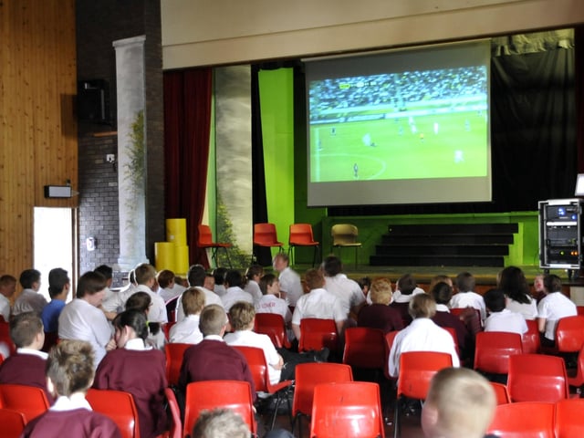 Graham School pupils watched the World Cup England match on a giant TV screen in the school hall.
102541m