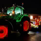 A tractor lit up ready for the Farmer Christmas Tractor Run.