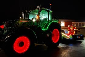 A tractor lit up ready for the Farmer Christmas Tractor Run.