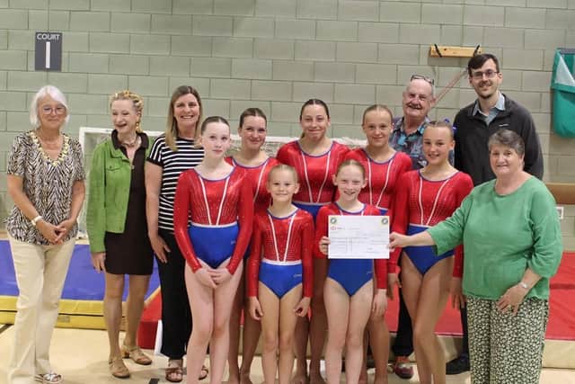 BridBeat Charity Singers present a cheque for £500 to Bridlington Gymnastics Club. Photo courtesy of Richard Attack