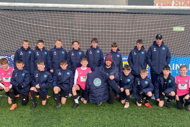 Ayton Under-13s showed off their new coats sponsored by GTM Plastering
